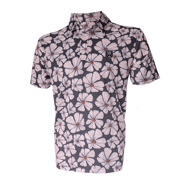 A golf polo shirt with a floral pattern in pink, white, and green colors on a black background.