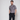 man wearing floral golf polo with hands in pockets