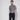 man wearing floral golf polo with hands in pockets