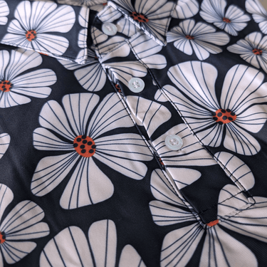 close up picture of floral golf polo